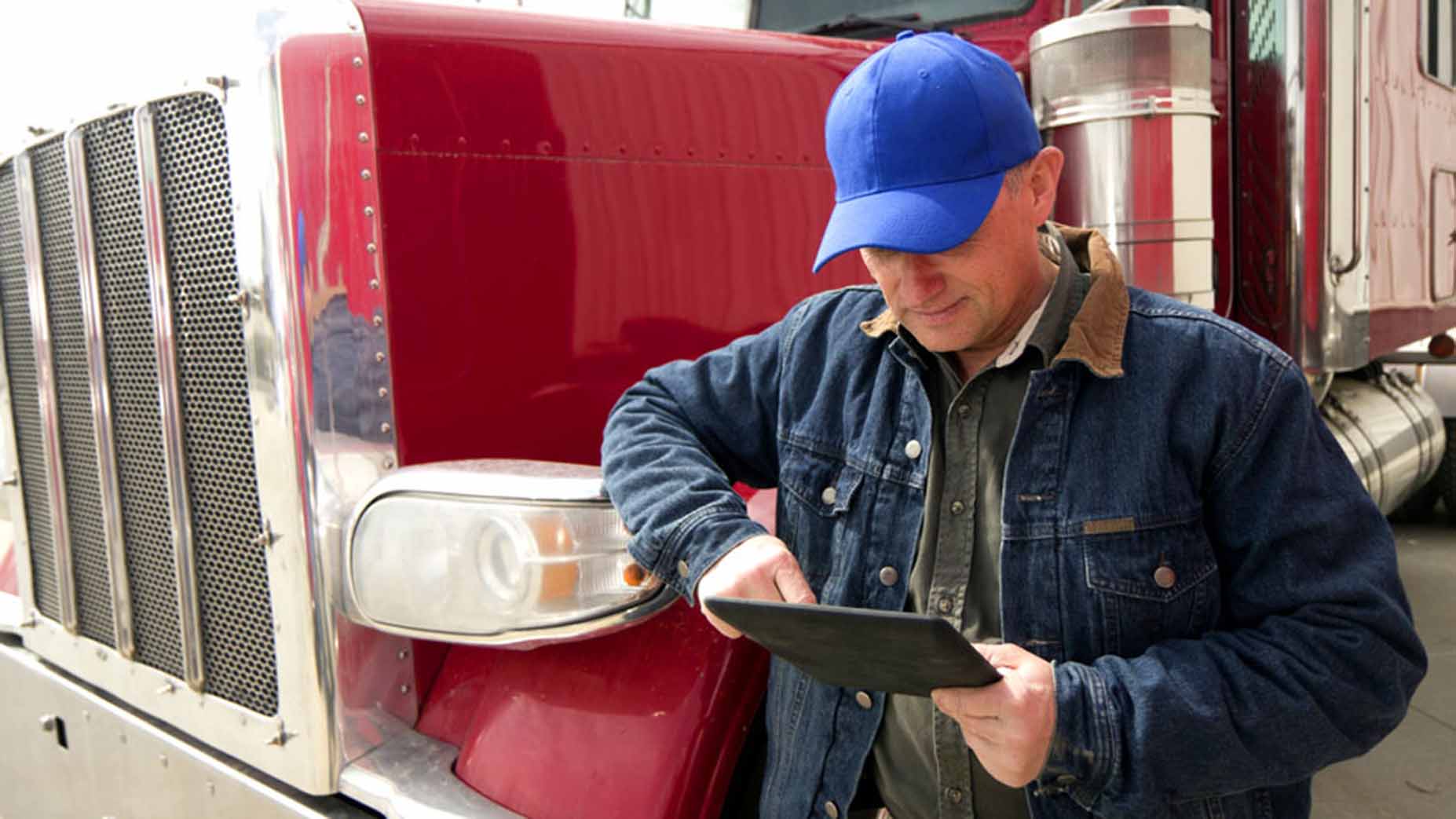 A man looking at tablet.